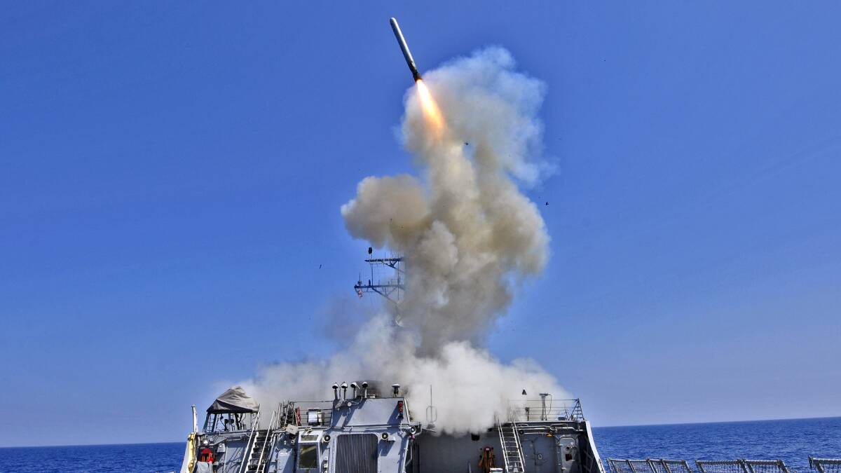 The US Navy guided-missile destroyer USS Barry launches a Tomahawk cruise missile. Picture Getty Images