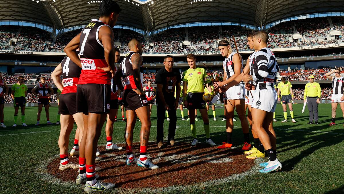 St Kilda and Collingwood players with Nicky Winmar in Adelaide. Picture Getty Images
