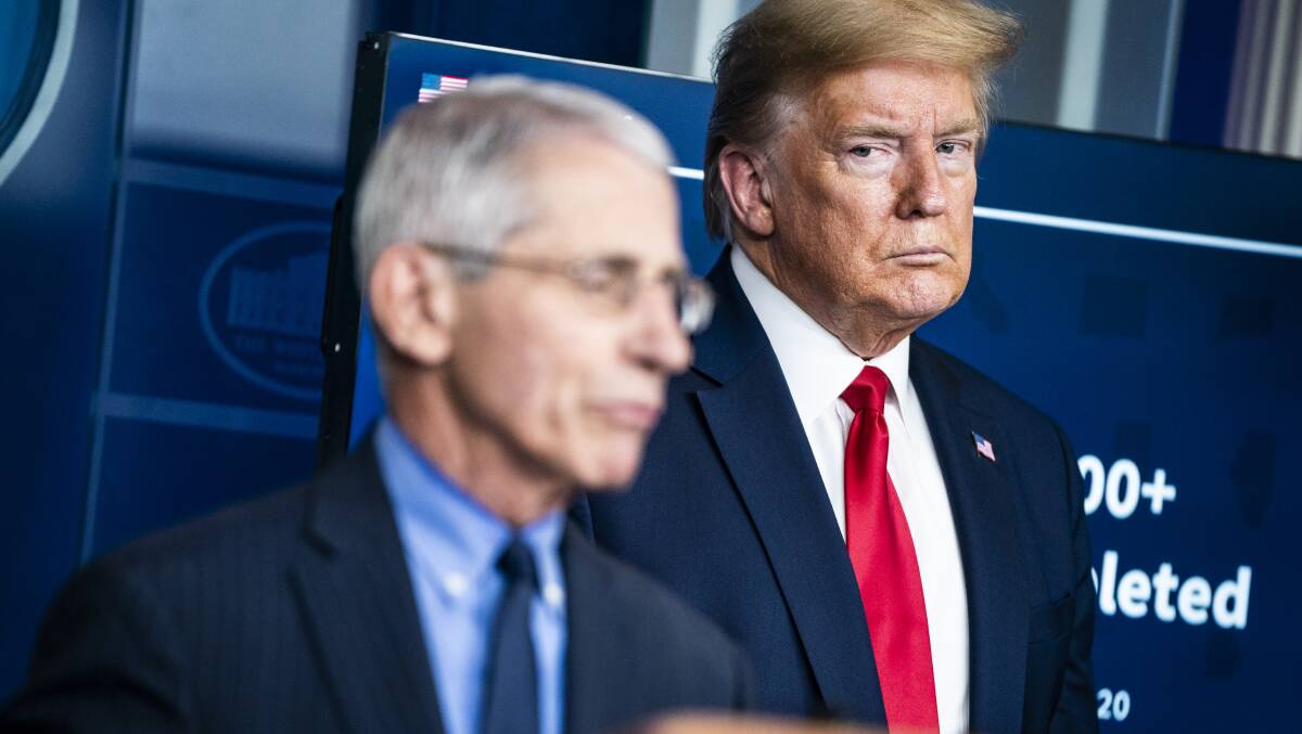 Former president Donald Trump listens to Dr. Anthony Fauci talk in April last year. Picture: Getty Images
