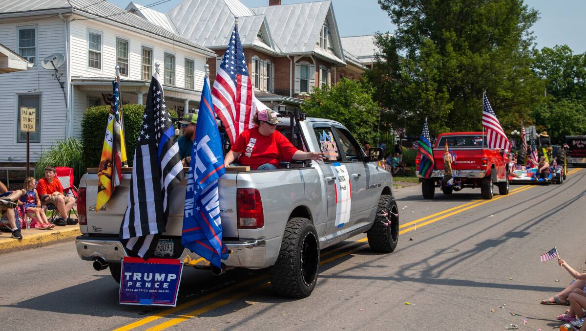 A July 4 parade in Pennsylvania this year. Gen-Xers have come of age in a time when Trumpism implicitly links the American flag with a peculiar brand of conservatism. Picture: Getty Images