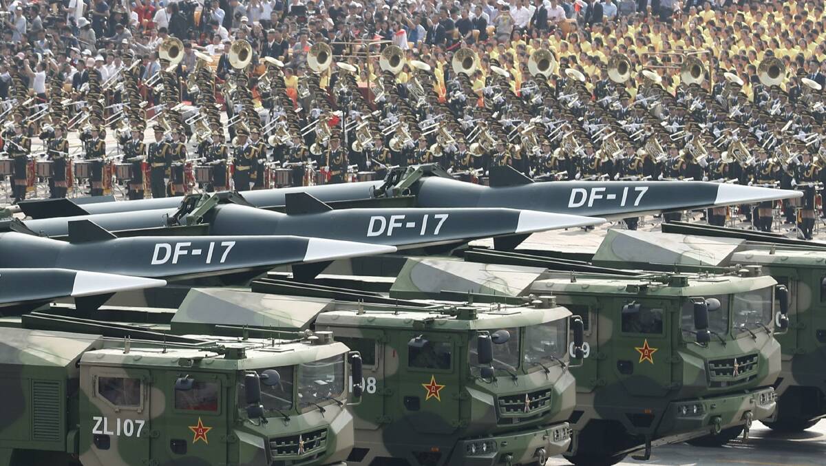 Military vehicles carrying DF-17 missiles parade during China's 70th anniversary. Picture: Getty Images