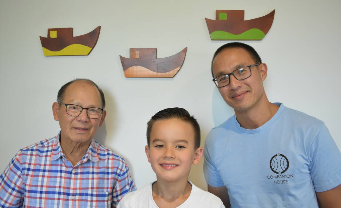 Thiet, Xavier and Kim Huynh in Canberra with their boats. Picture: Supplied