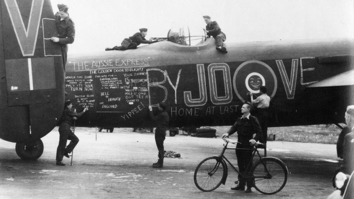 RAAF crewmen of 463 Squadron have some fun between missions with chalk art on Lancaster bomber LM309 JO-V. This aircraft was lost in a midair collision in action in September 1944. Picture: Department of Defence
