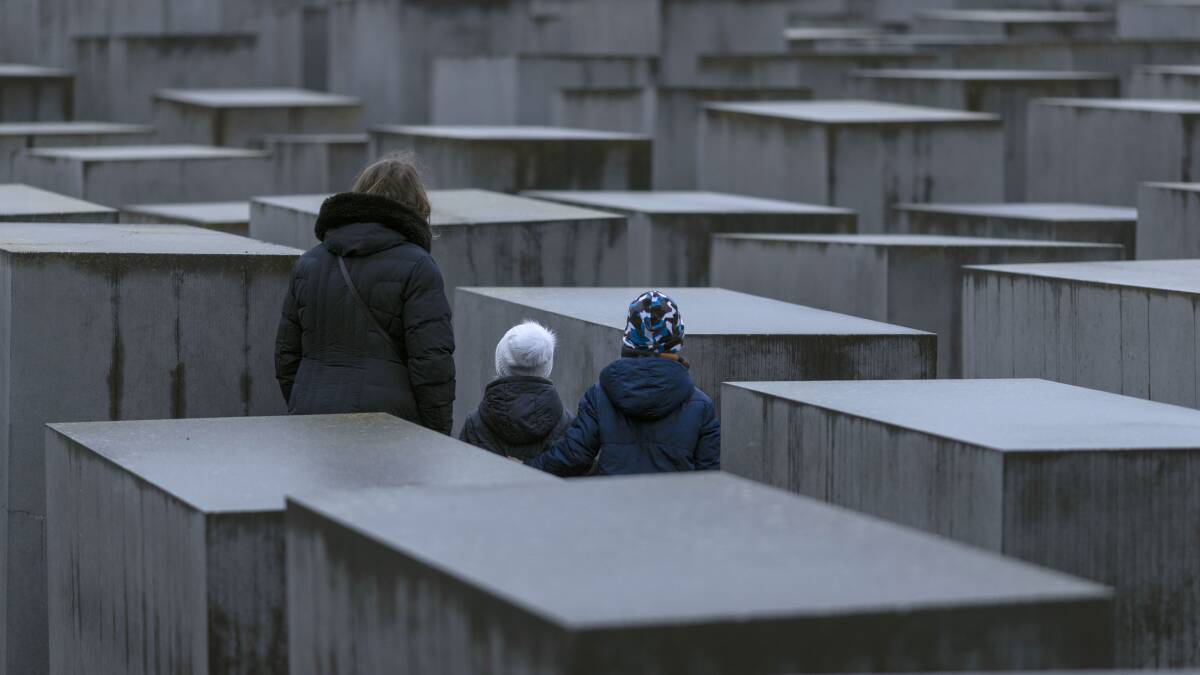Visitors stand at the Holocaust Memorial in Berlin on International Holocaust Remembrance Day. Picture Getty Images