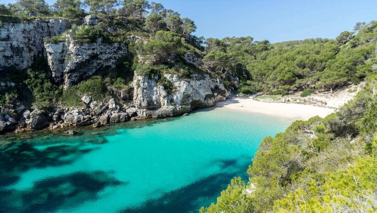 Macarella Beach in a sheltered cove on the southern shore of the Spanish island of Menorca. Picture: Michael Turtle