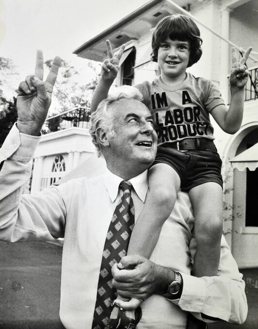 Alexander Whitlam sits on his grandfather - and prime minister at the time - Gough Whitlam's shoulders at The Lodge in November 1975. Picture: The Canberra Times