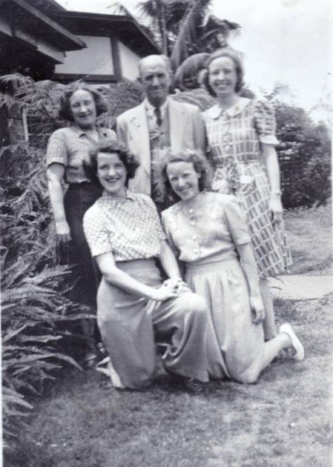 Elizabeth Lusby (kneeling right) with her parents and sisters - petty officer Judith Lusby kneeling, and major Gwen Lusby standing - during the war. Picture: Supplied

