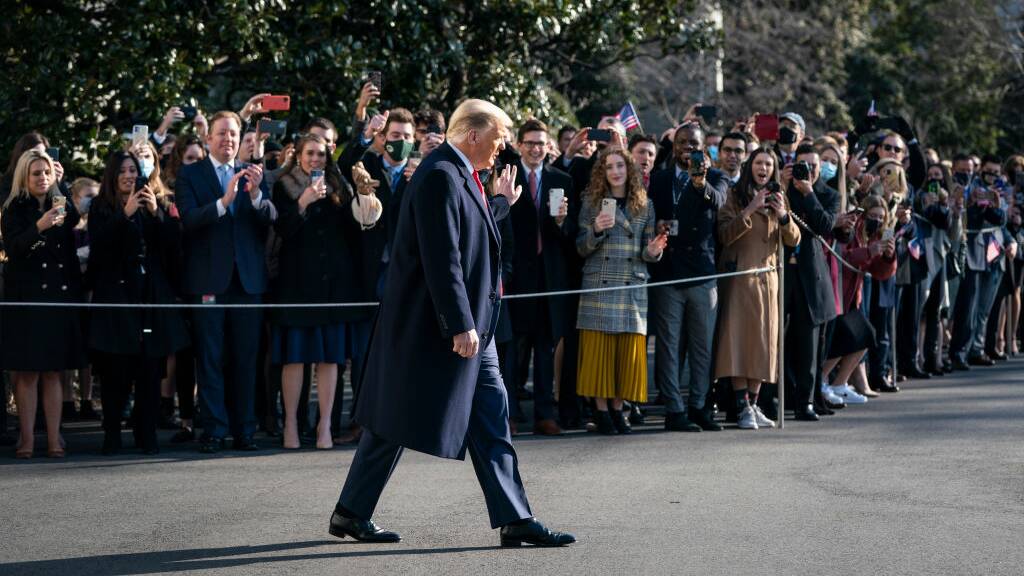 Donald Trump waves to staff and supporters as he leaves the White House earlier this month. Picture: Getty Images