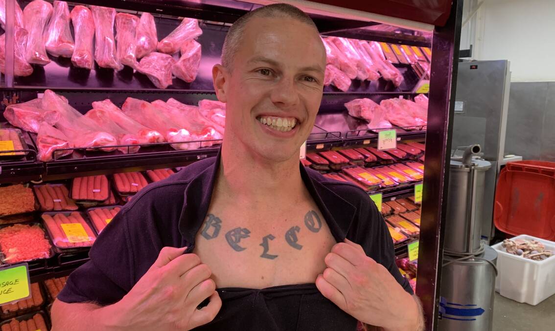 Daniel Hall, of Hawker Butchery, shows off his Belco pride tatt. Picture: Bree Element