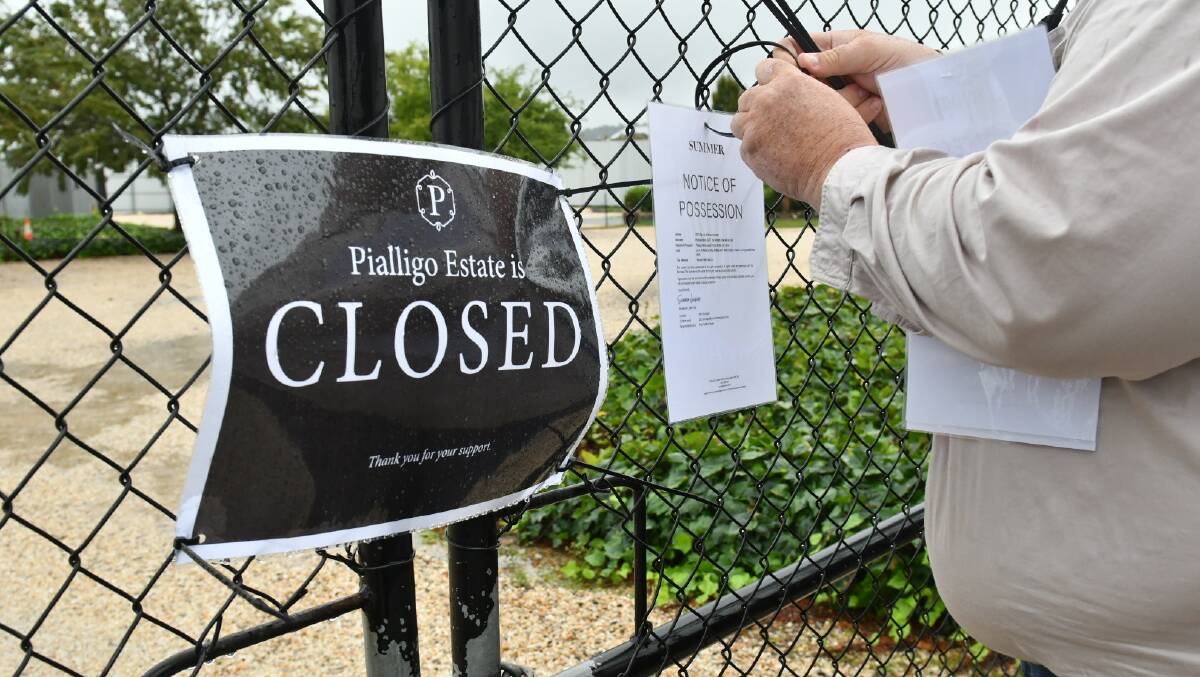 Agents at Pialligo Estate secure the property after the business closed overnight. Picture by Elesa Kurtz