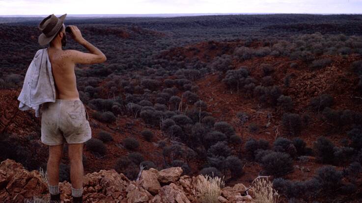Ian Dunlop enjoying a break from filming to savour the view in the Australian outback. Picture: Supplied