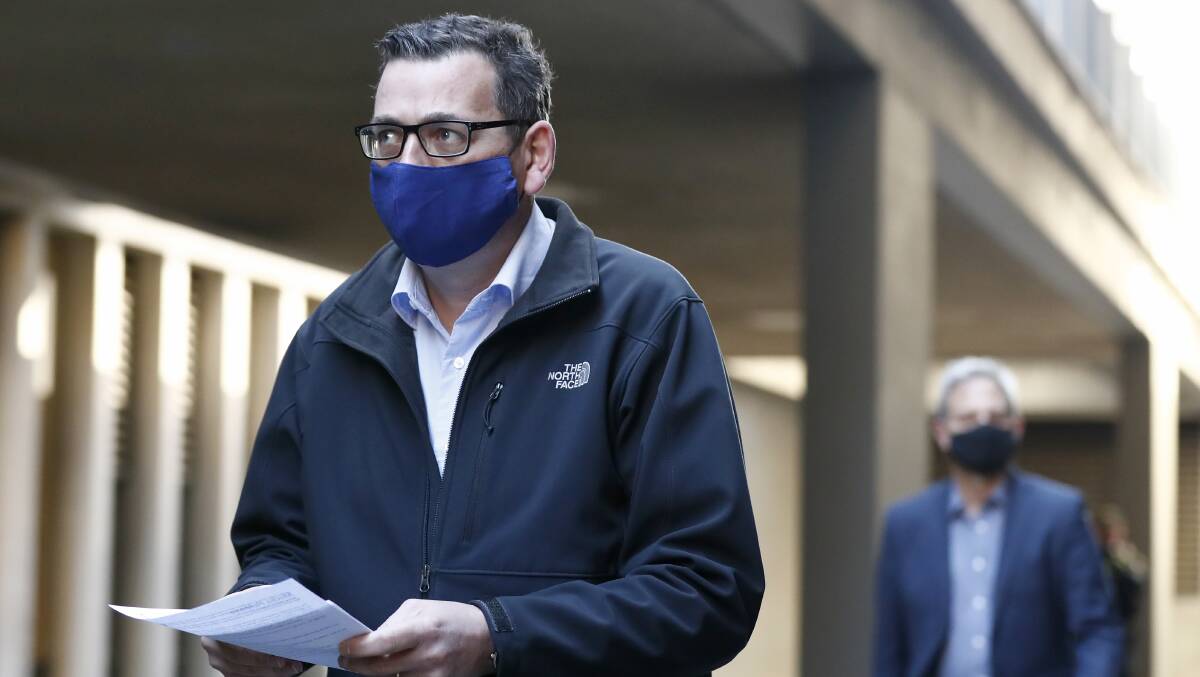 Victorian Premier Daniel Andrews wears a face mask as he walks to a daily briefing duing Victoria's second outbreak of COVID-19 this month. Picture: Getty Images