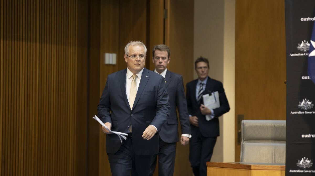 Prime Minister Scott Morrison, Education Minister Dan Tehan, and Attorney-General Christian Porter walk out for a press conference on Thursday. Picture: Sitthixay Ditthavong