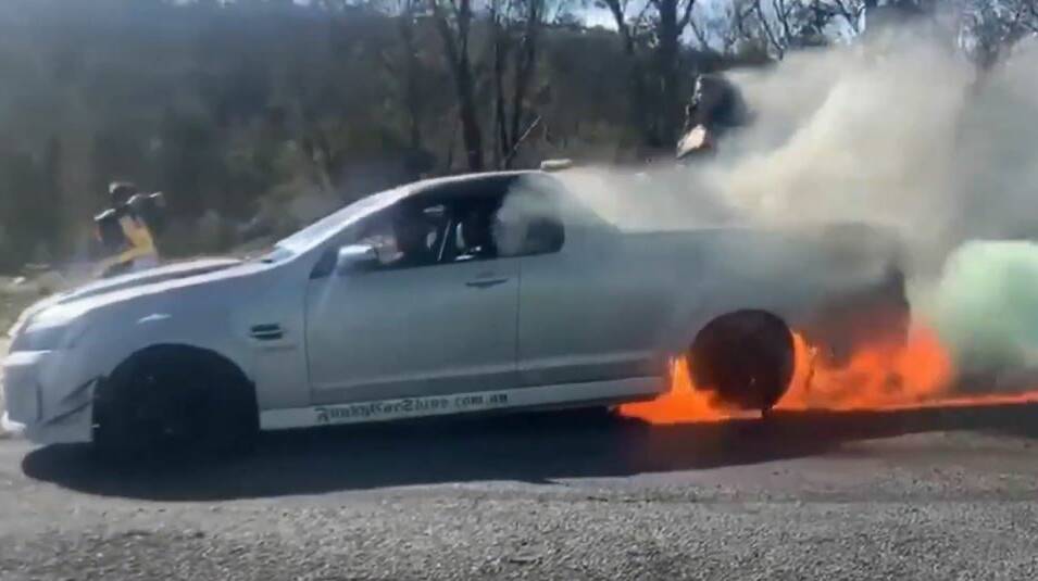 The back of the ute catching fire during the burnout. Photo: Supplied. 