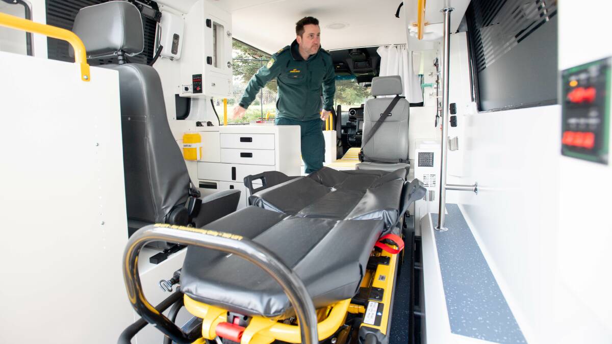 Intensive care paramedic Pat Meere demonstrates the use of the electric stretchers. Picture: Karleen Minney