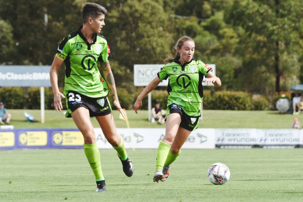 Laura Hughes (right) and Michelle Heyman have both committed to Canberra United for another year. Picture: Dion Georgopoulos