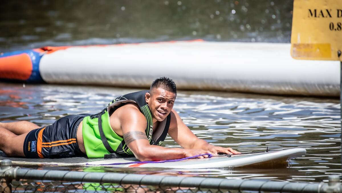 Brumbies captain Alaalatoa finds some relief on a stand-up paddle board at the Canberra Aqua Park Picture: Karleen Minney