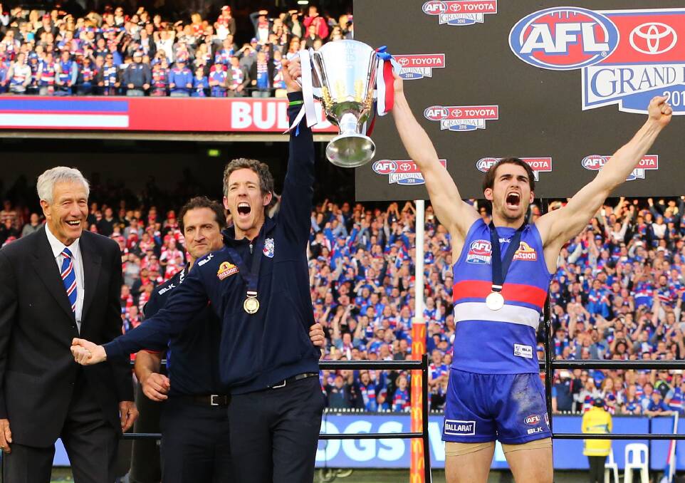 Bob Murphy and Easton Wood hold the 2016 AFL premiership cup aloft. Picture: Getty