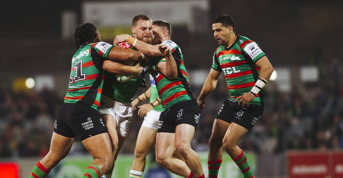 Elliott Whitehead is met by some Rabbitohs defence at Canberra Stadium on Thursday night. Picture Dion Georgopoulos