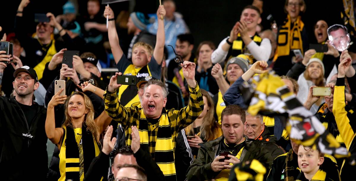 Richmond fans celebrate last weekend's preliminary final win. Picture: Getty Images.