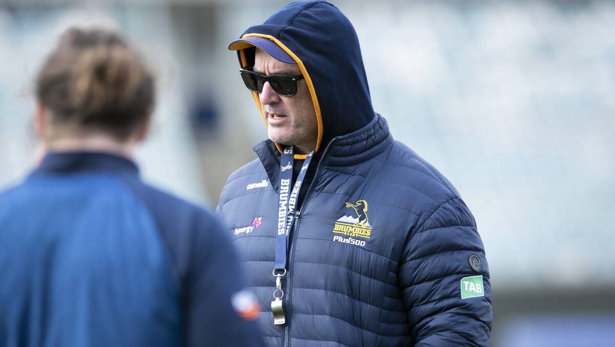 Brumbies coach Dan McKellar is rugged up and ready to go for the Highlanders clash. Picture: Keegan Carroll