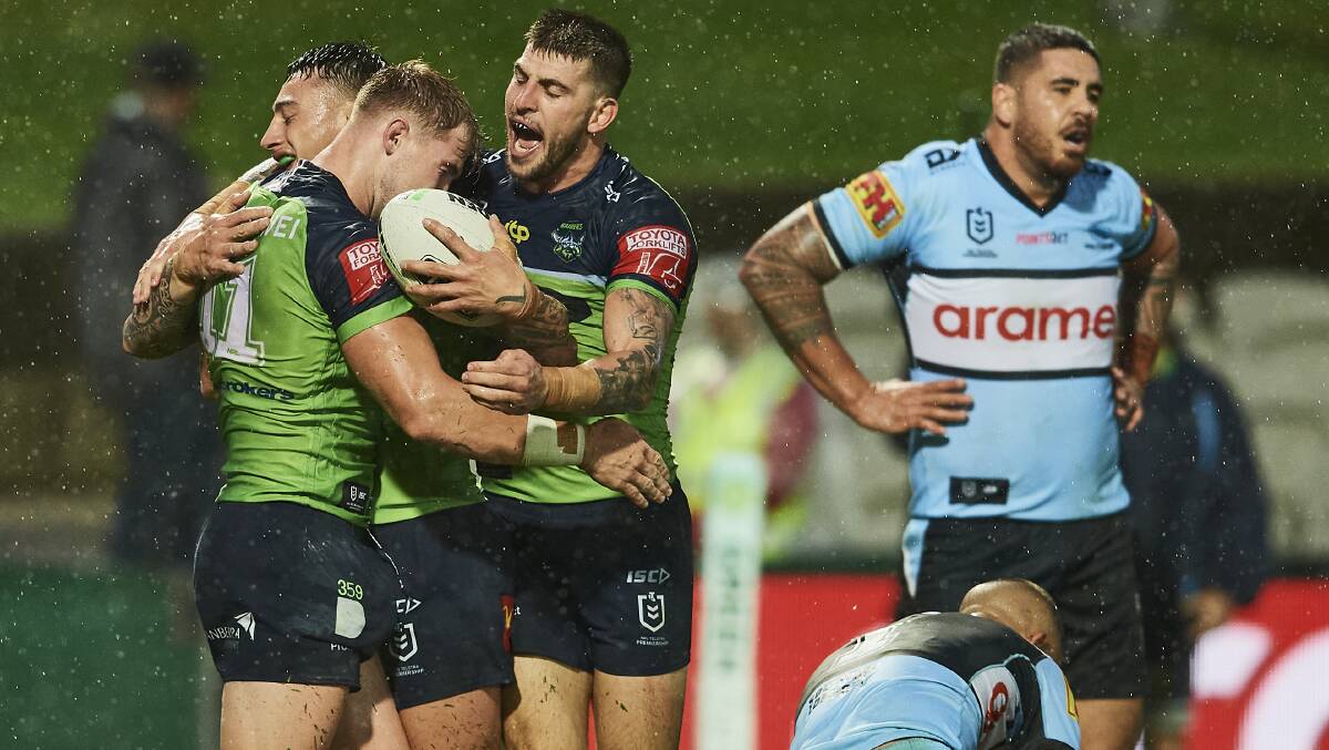 Charnze Nicoll-Klokstad and Curtis Scott celebrate with Hudson Young, who has scored in both games for the Raiders so far this season. Picture: Getty Images