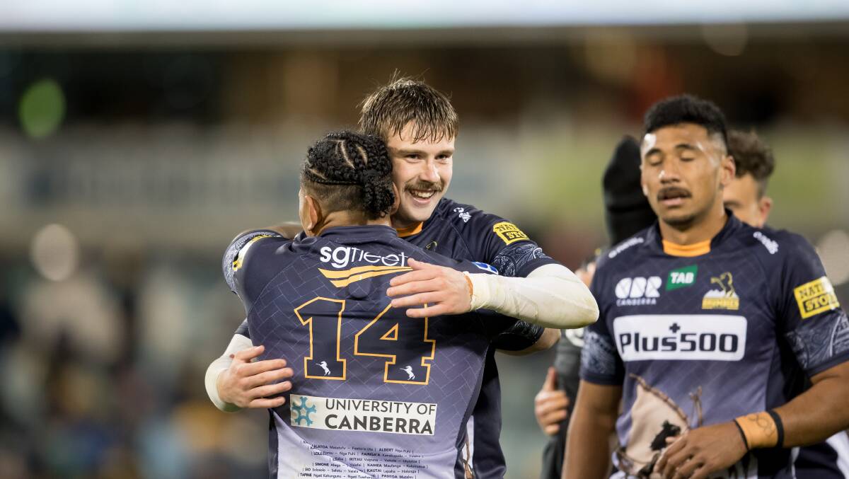 Mack Hansen and Solomone Kata celebrate the Brumbies' win over the Hurricanes. Picture: Sitthixay Ditthavong