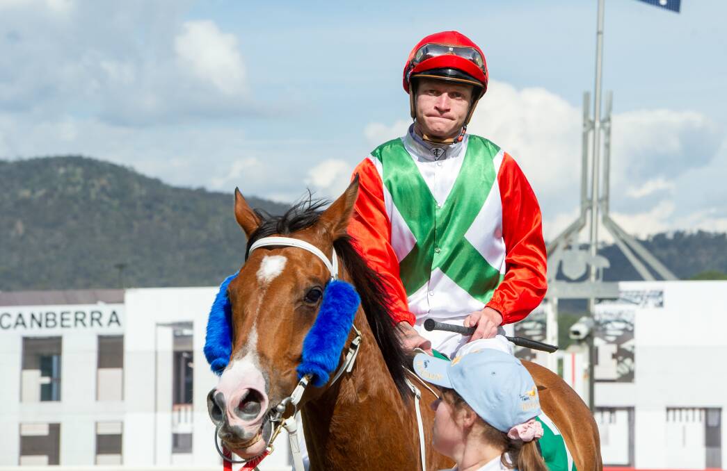 Blaike McDougall leads Express Courier back to scale after wining the Federal Handicap. Picture: Elesa Kurtz.