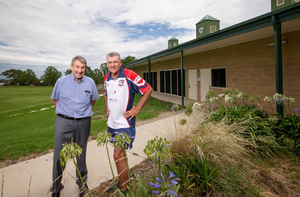 Ian McNamee and Peter Solway have had the pavilion and scoreboard at Queanbeyan's Freebody Oval named after them. Picture: Sitthixay Ditthavong