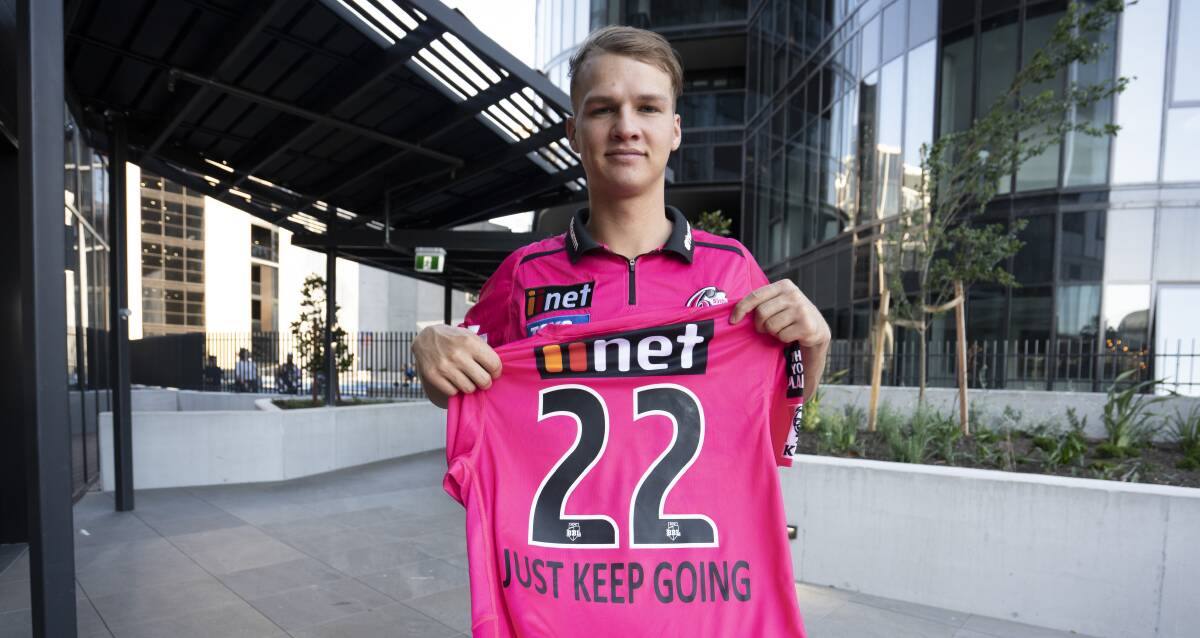 Sydney Sixers young gun Josh Philippe with the jersey he will wear on Saturday.