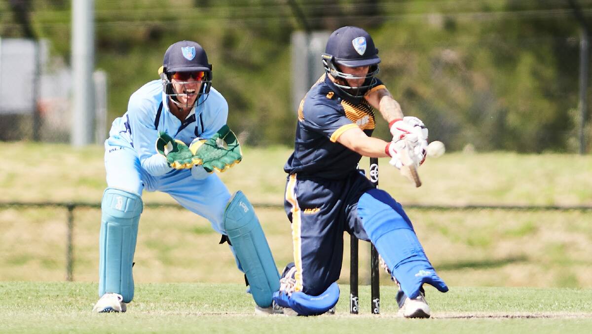 NSW Metro wicketkeeper Baxter Holt at the ready as Nicholas Cutler sweeps for ACT/NSW Country. Picture: Matt Loxton.