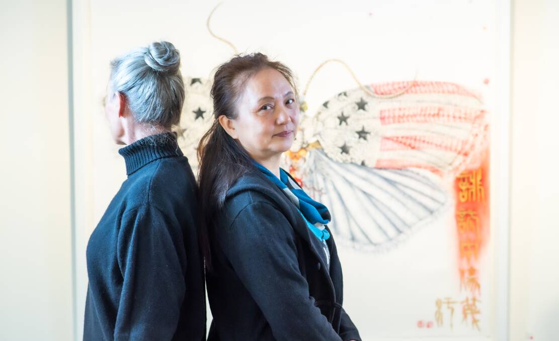 eX de Medici, left, with Chinese-born Canberra artist Wei Rong Wu. Picture: Karleen Minney