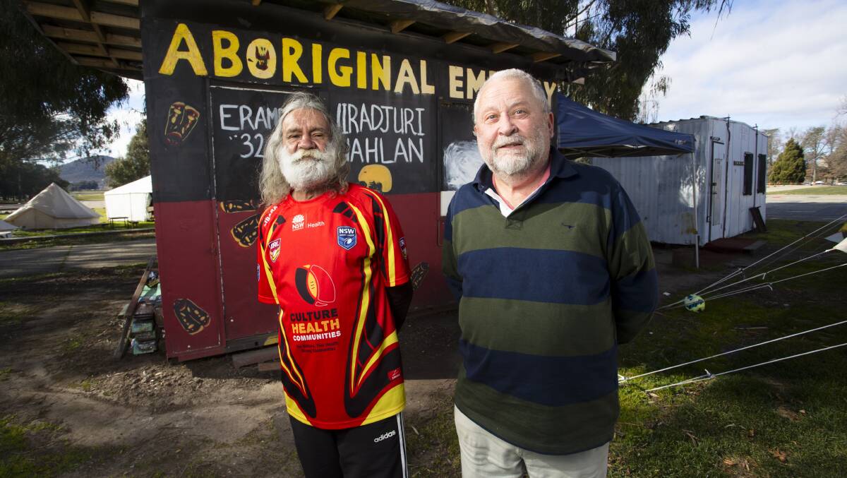 Steve Padgham, right, with Yorta Yorta man Paul Whyman at the Aboriginal Tent Embassy, 50 years after protesting its removal by police in 1972. Picture: Keegan Carroll