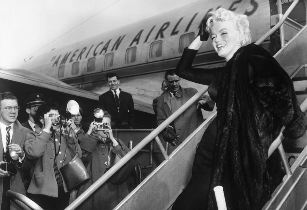 Marilyn Monroe boards an American Airlines plane for Hollywood in 1956. Picture: Getty Images