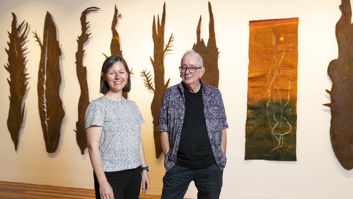 New director of Canberra Contemporary Art Space Janice Falsone with outgoing director David Broker, with works from the latest exhibition Carbon Neutral. Picture: Keegan Carroll