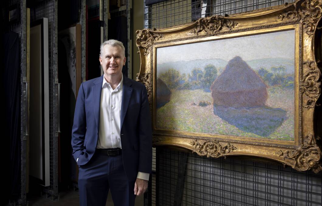 Minister for the Arts Tony Burke at the National Gallery with Claude Monet's Meules, milieu du jour [Haystacks, midday], 1890. Picture National Gallery of Australia