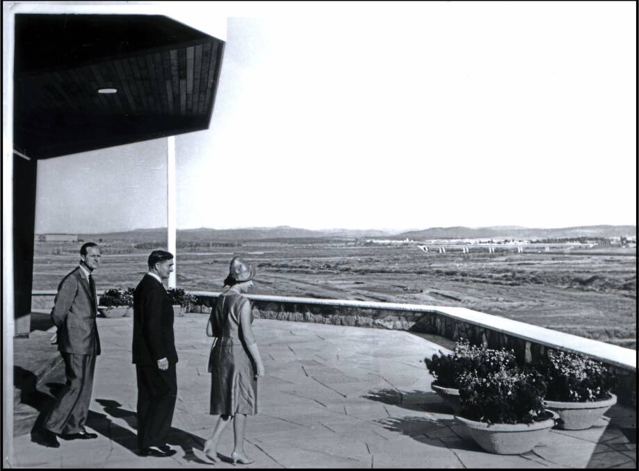 Prince Philip and Queen Elizabeth at Regatta Point, surveying the still-empty Lake Burley Griffin site in 1963. Picture: ArchivesACT