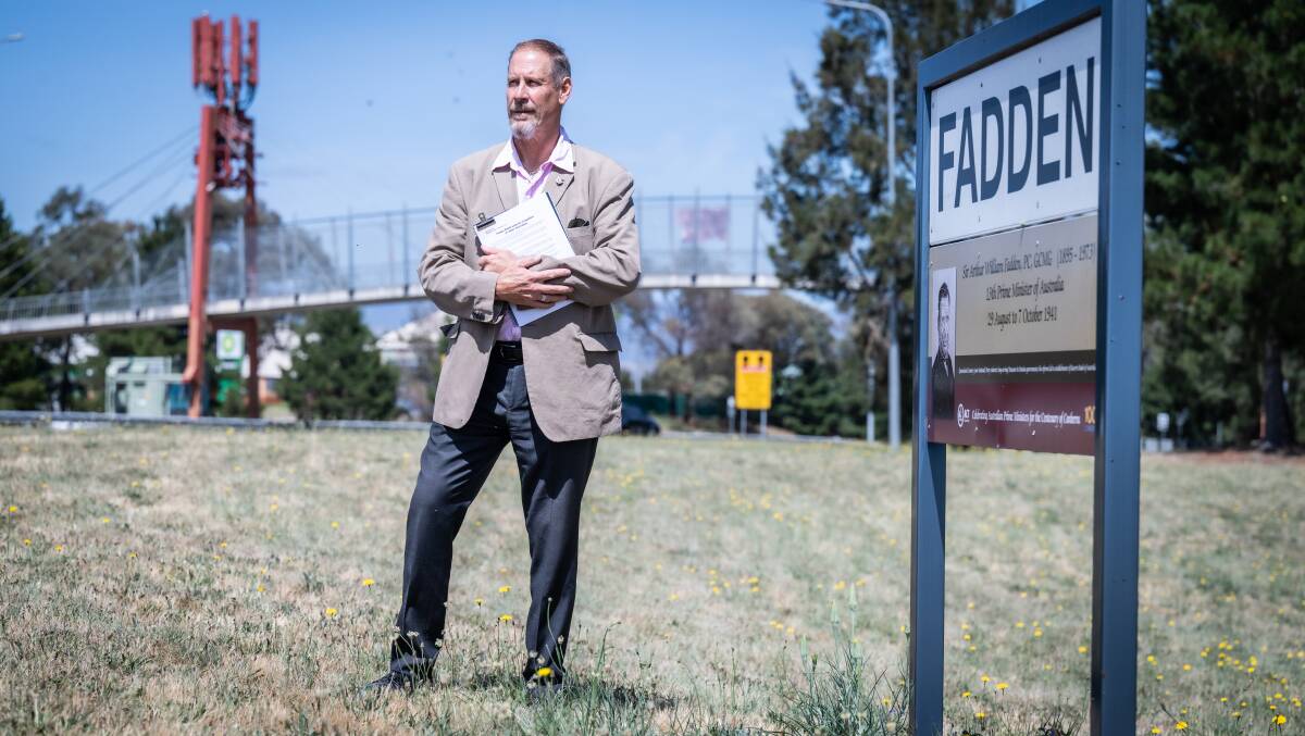 Andrew Fraser with the sign for Fadden, commemorating Arthur Fadden, who was Prime Minister for just 40 days. Picture by Karleen Minney