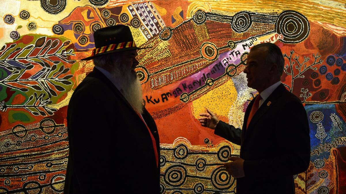Senator Pat Dodson and then Australian War Memorial director Dr Brendan Nelson speak in front of the APY painting in 2018. Photo: Sitthixay Ditthavong
