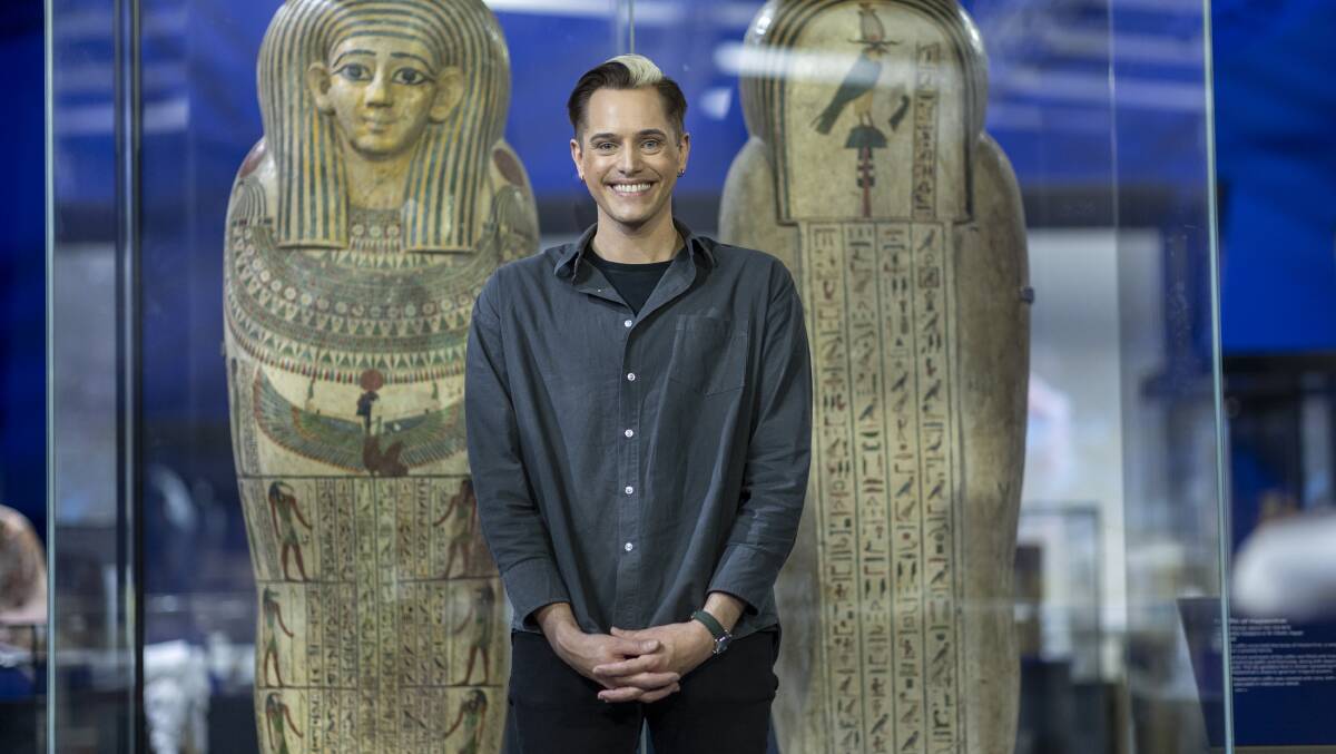 National Museum of Australia curator Craig Middleton with two spectacular coffins recently installed as part of the upcoming Discovering Ancient Egypt exhibition Picture by Gary Ramage 