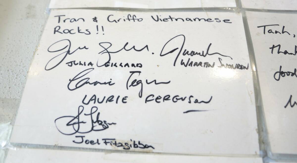 Julia Gillard, Warren Snowdon, Laurie Ferguson and Joel Fitzgibbon's names on the signature wall at Griffith Vietnamese Restaurant. Picture by Jeffrey Chan
