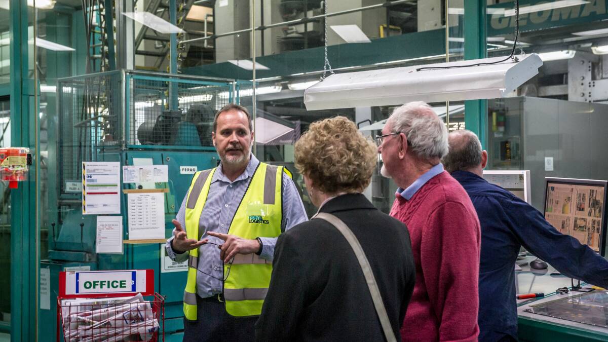 Jon Clarke leads subscribers on a tour of the Canberra Times presses in 2019. Picture by Karleen Minney