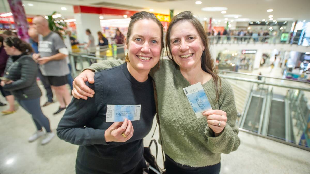 Sisters Jo and Kate Pickles, with the Taylor Swift tickets they bought after standing in an actual queue at Songland Records, Cooleman Court. Picture by Karleen Minney