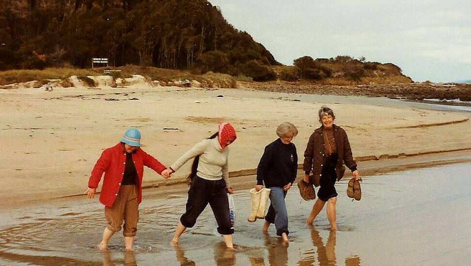 The Leech family wading to Broulee Island in 1983. Picture by John Leech