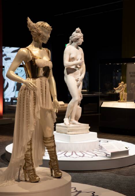A costume worn by Kylie Minogue for her Aphrodite Les Folies tour in 2011, alongside a statue of Venus (100-150 CE), on loan from the British Museum