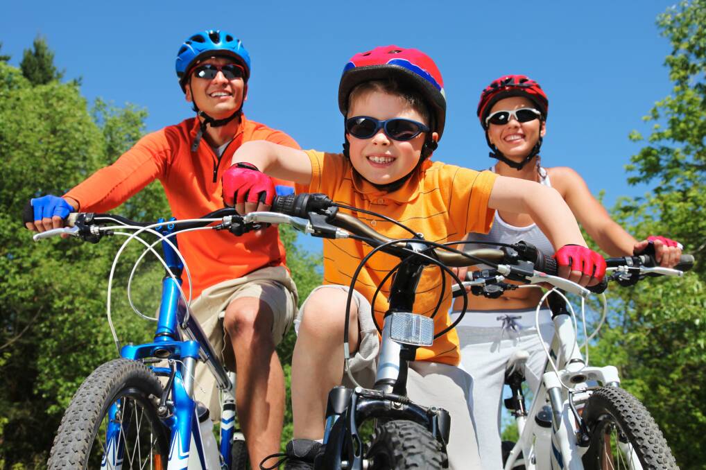 Family fun: Don't buy a bike that 'they will grow into' as this can be dangerous and frustrating for the child. Photo: Shutterstock