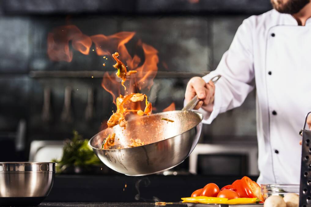 Cooking up a storm in a trendy restaurant in Canberra. Picture by Shutterstock