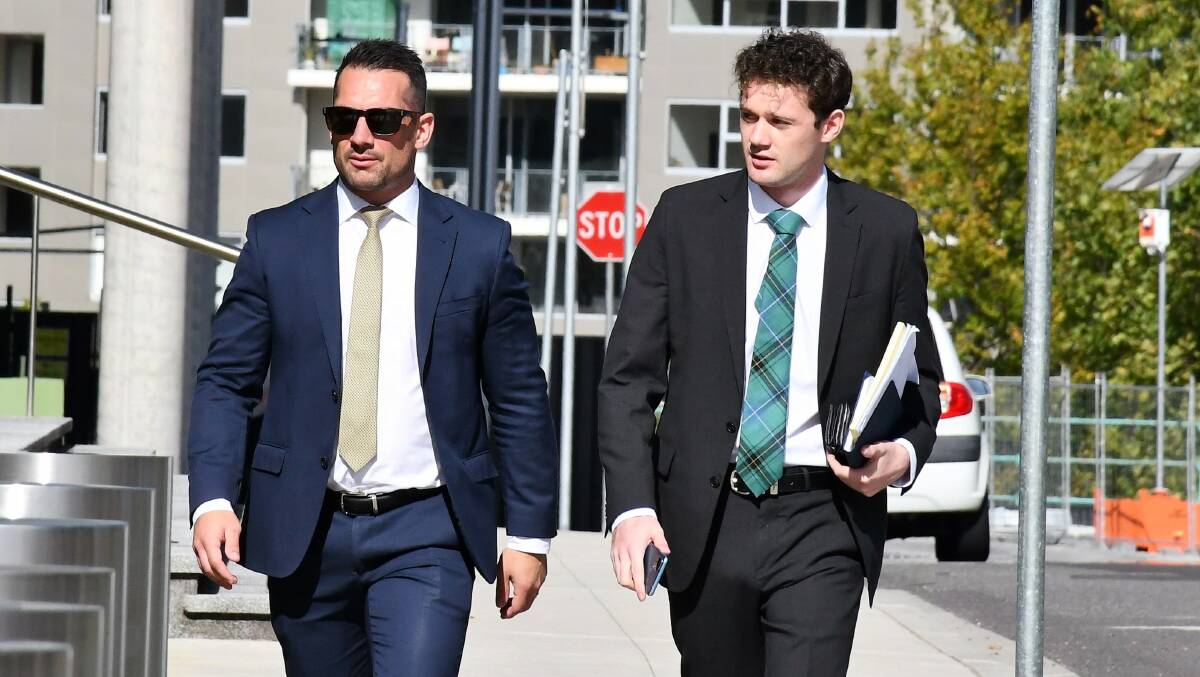 Alexander Matters, right, walks to court with one of his barristers, James Maher, on Tuesday. Picture by Hannah Neale