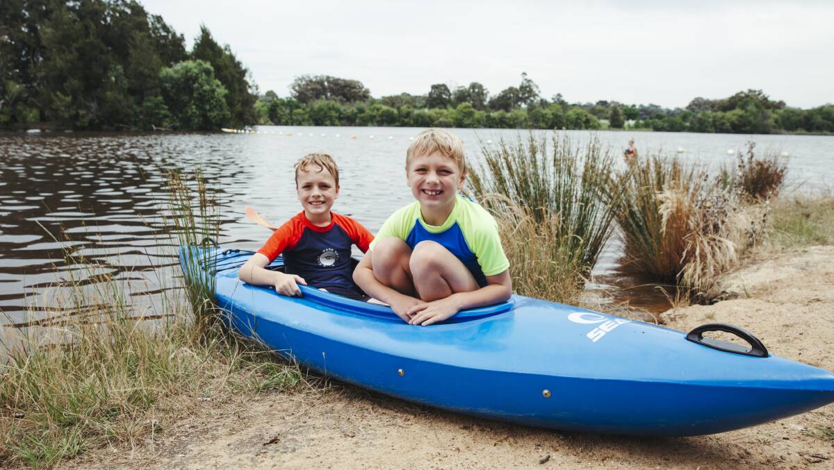 Liam Allen, 8, and James Allen, 10, kayaking at Black Mountain Peninsula as Canberra gets a taste of summer. Picture: Dion Georgopoulos 