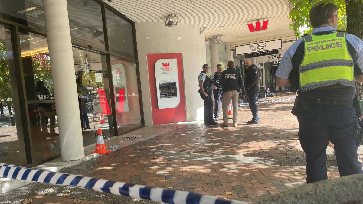 Police cordoned off the entrance to the bank after the alleged robbery. Picture by Megan Doherty
